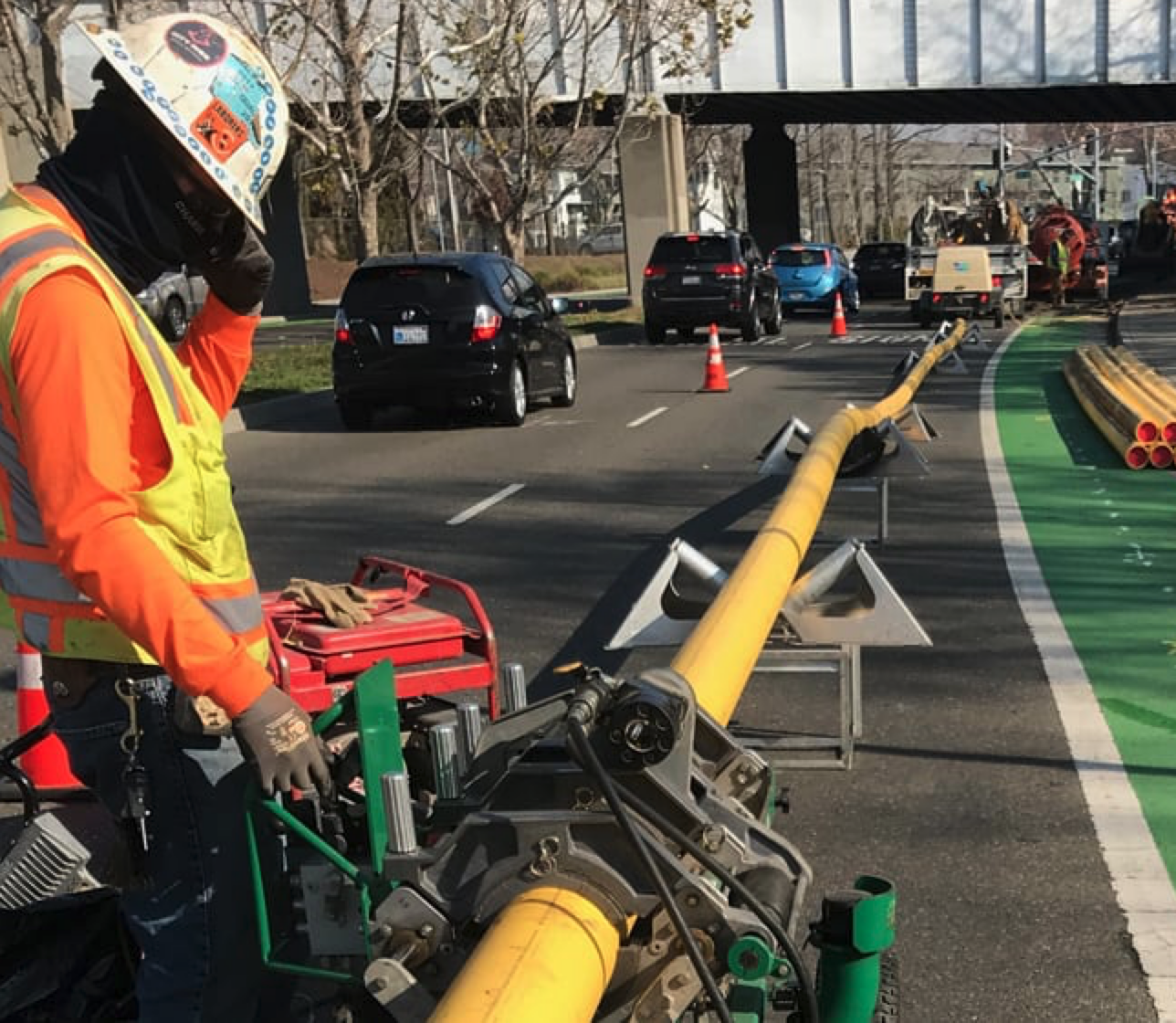 Construction worker working on pipeline installation